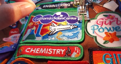 Picture of a patch that has been machine sewn on with invisible thread.